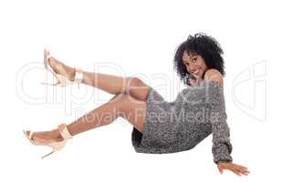 African American woman sitting on floor.