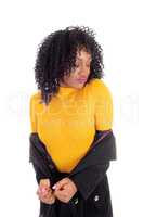 African American woman in yellow sweater.