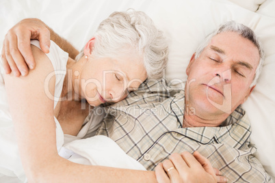 Peaceful senior couple sleeping