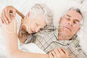 Peaceful senior couple sleeping