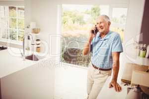 Smiling senior man on a phone call