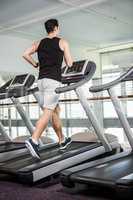 Fit man running on treadmill