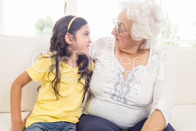 Grandmother and granddaughter looking at each other