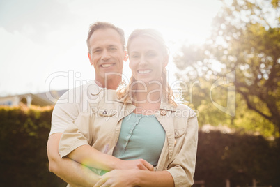 Cute couple with arms around each other