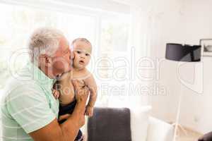 Senior man playing with his grandson