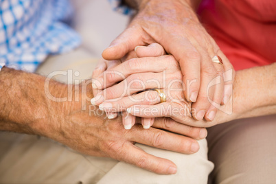 Senior couples hands together