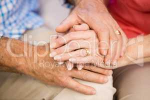 Senior couples hands together