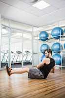 Man doing exercise with medicine ball