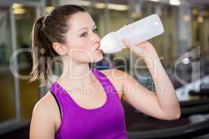 Brunette drinking water