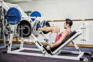 Muscular man doing exercise for legs