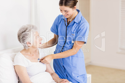 Doctor taking care of suffering senior patient