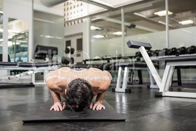 Shirtless man doing push up