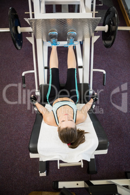 Fit brunette doing exercises for legs