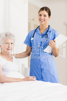 Doctor taking care of suffering senior patient