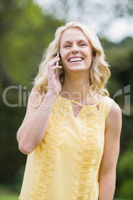 Happy woman making a phone call