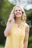 Happy woman making a phone call