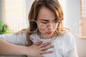Pretty woman suffering from chest pain