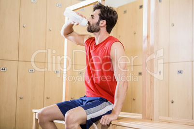 Handsome man drinking water