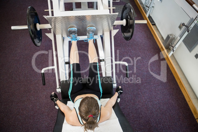 Fit brunette doing exercises for legs