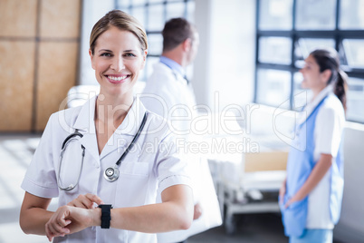 Nurse checking her smart watch