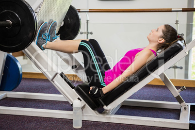 Fit brunette doing exercises for legs