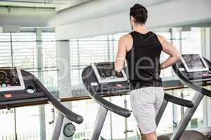 Fit man running on treadmill