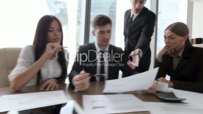 Business people discuss contract