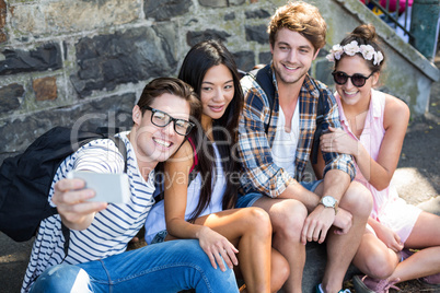 Hip friends taking selfie