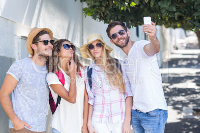 Hip friends taking selfie