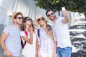 Hip friends taking selfie