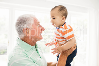 Senior man playing with his grandson