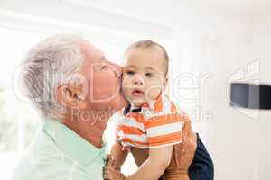 Senior man playing with his grandson