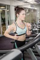 Fit brunette on treadmill