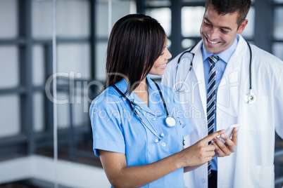 Medical team looking at phone together