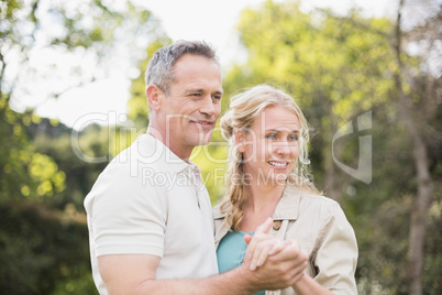 Cute couple dancing and holding hands