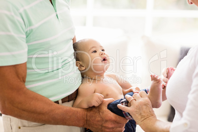 Senior man playing with his grandson