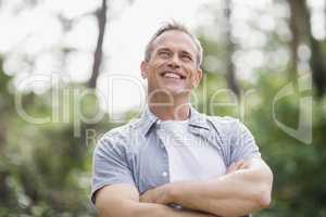 Smiling man crossing his arms