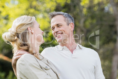 Cute couple hugging with arms around