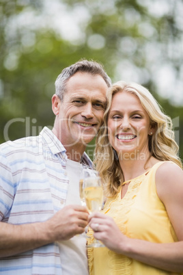 Happy couple drinking champagne