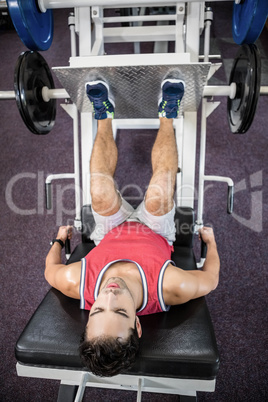 Muscular man doing exercise for legs