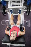 Muscular man doing exercise for legs