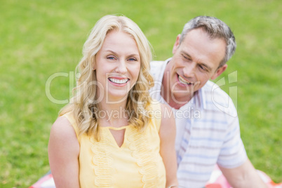 Happy couple smiling at camera