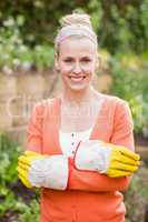 Cute woman wearing gardening gloves