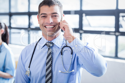 Happy doctor on the phone