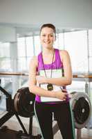 Smiling trainer holding clipboard