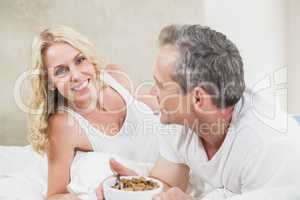 Cute couple having a bowl of cereals