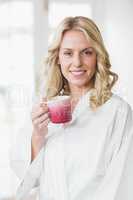 Pretty woman having a cup of coffee