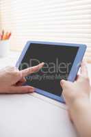 Close up view of businesswoman using her tablet