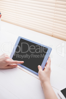 Close up view of businesswoman using her tablet