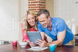 Cute couple looking at tablet